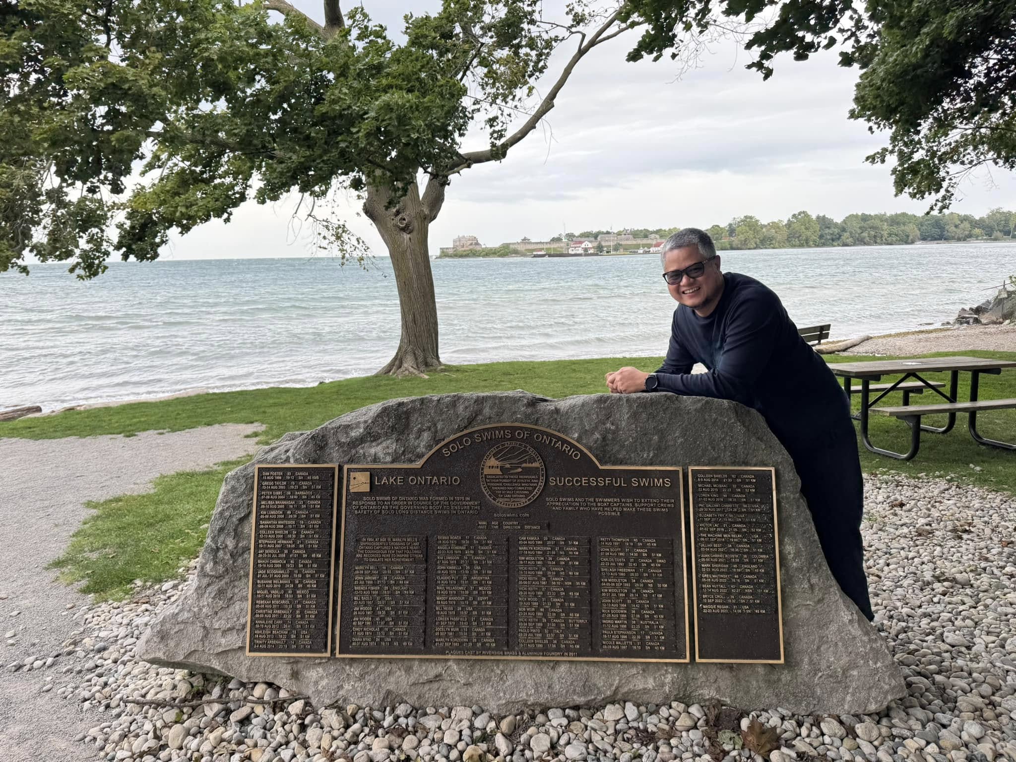 Rovic Cruz by the shore of Lake Ontario during travel